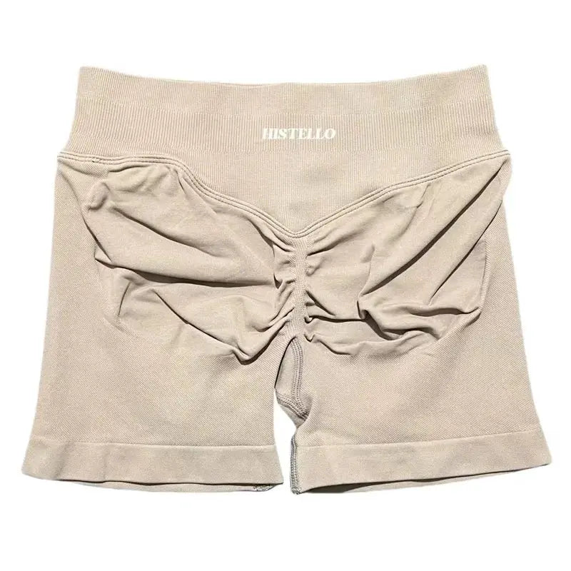 HISTELLO beige sports shorts with ruched back seam and elastic waistband