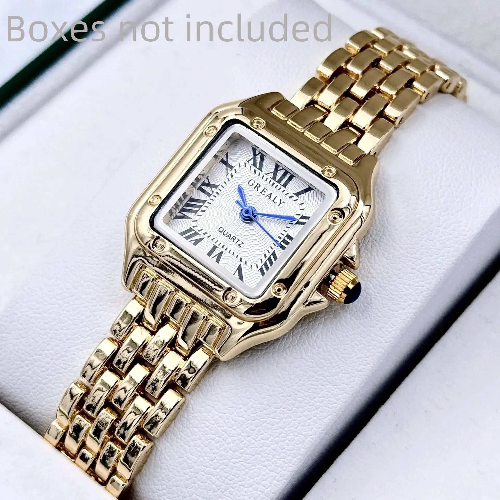 Gold-tone stainless steel women's wristwatch with rectangular face, blue hands, quartz movement.