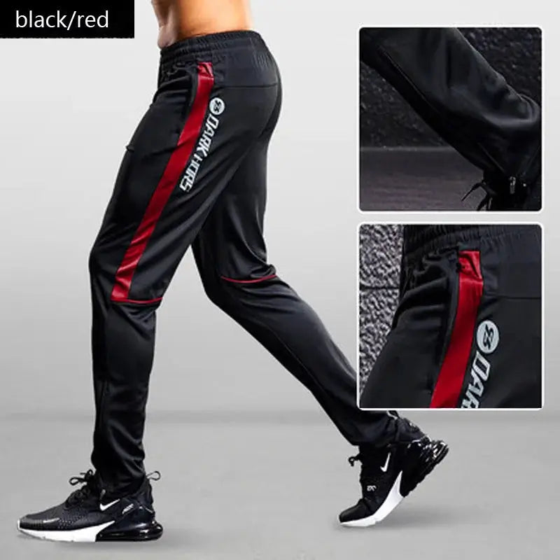 Men's black sport pants with red side stripe and zip pockets, athletic joggers for running