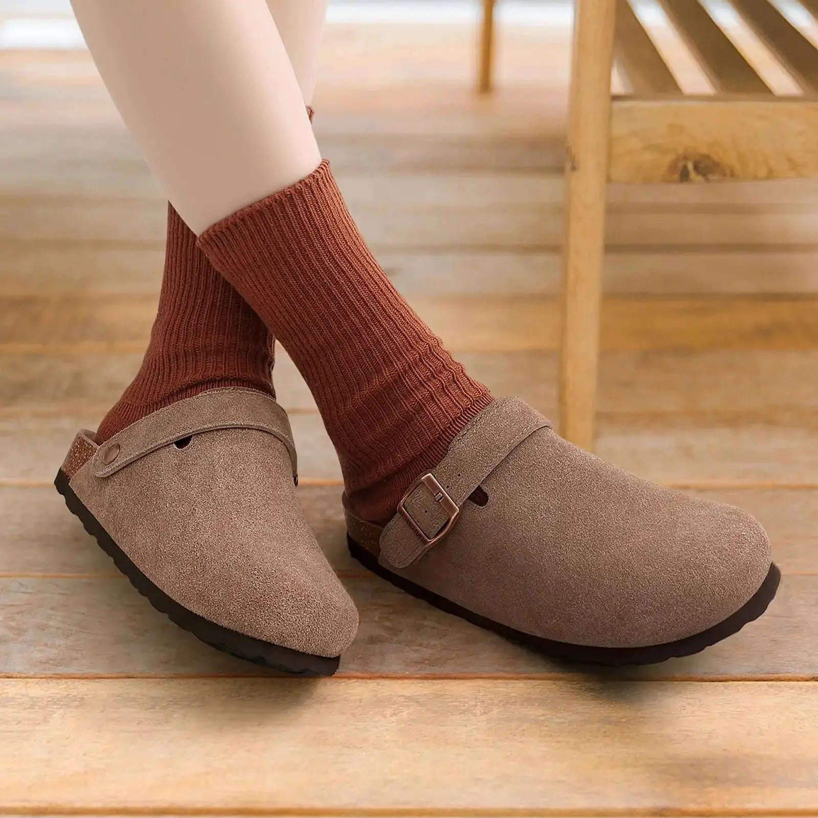 Crestar women's suede clogs with adjustable strap and cork footbed in brown.