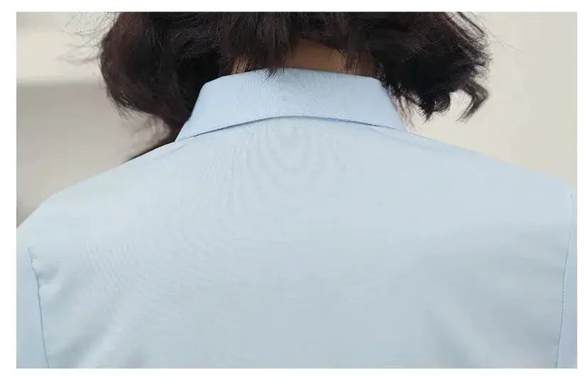 Light blue women's shirt, back view, long-sleeve office blouse by Simples Market
