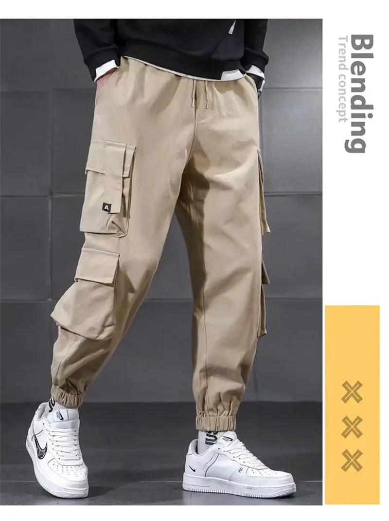 Beige men's cargo pants with multiple pockets and elastic cuffs
