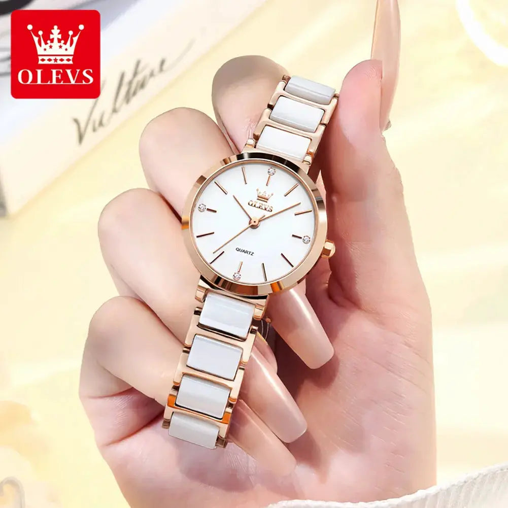 OLEVS ladies wristwatch with rose-gold case, white dial, quartz movement, and white ceramic bracelet