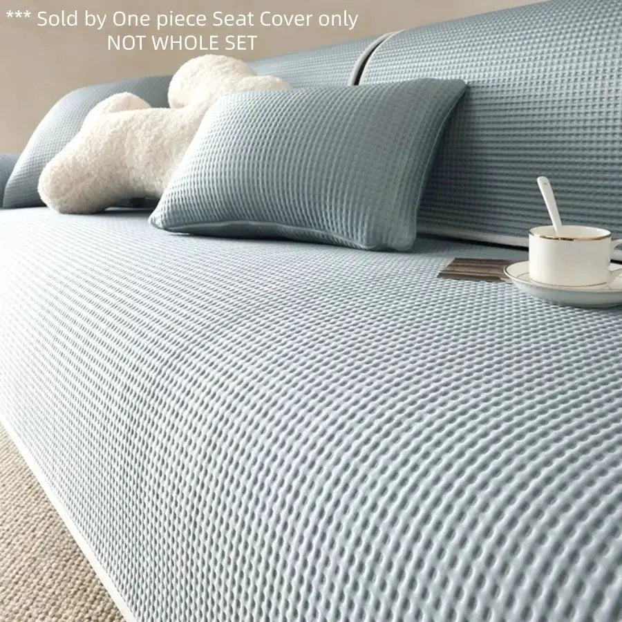 Simples Market Summer Cooling Touch anti-slip blue textured sofa cover on a living room sofa with cushions