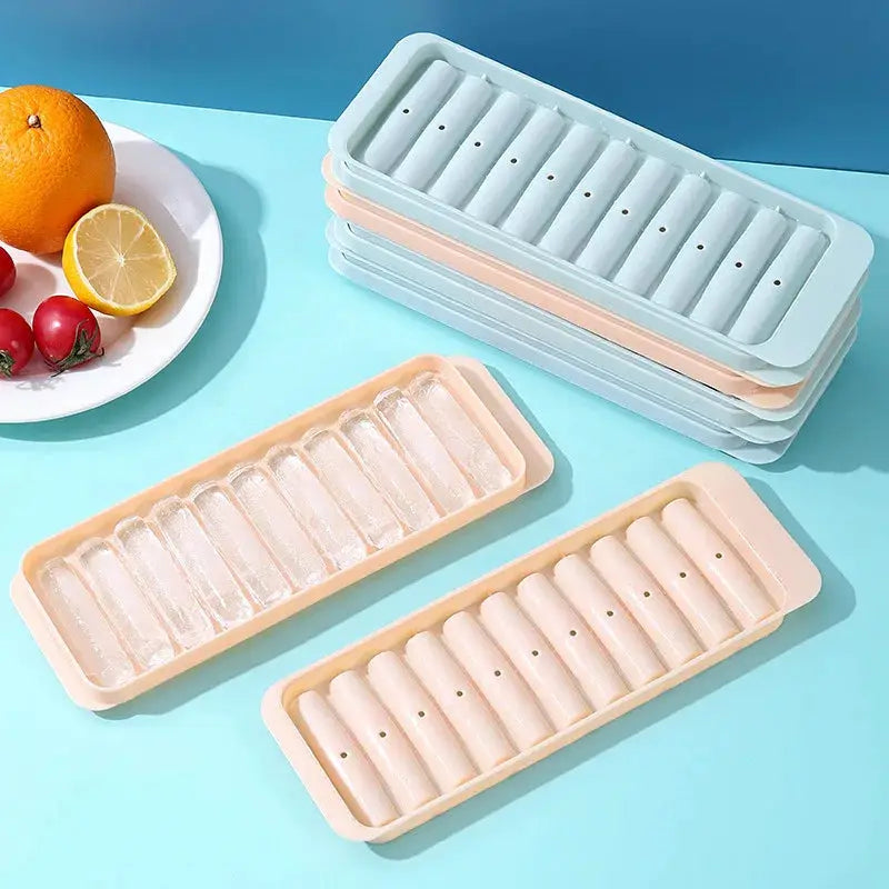 Simples Market plastic cylindrical ice cube mold set in pastel blue/peach trays for long ice cubes.