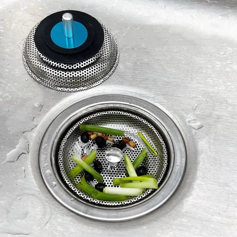 Waste Plug Sink Strainer by Simples Market, stainless steel drain filter with perforated mesh and blue plug.