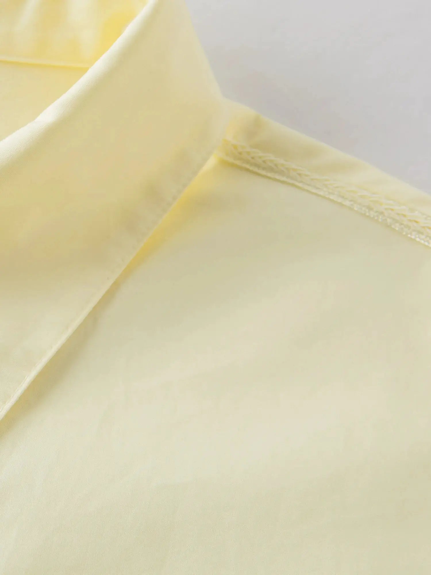 FSLE Premium Series women's cotton shirt by Simples Market, yellow, loose-fit long-sleeve blouse with web strap.