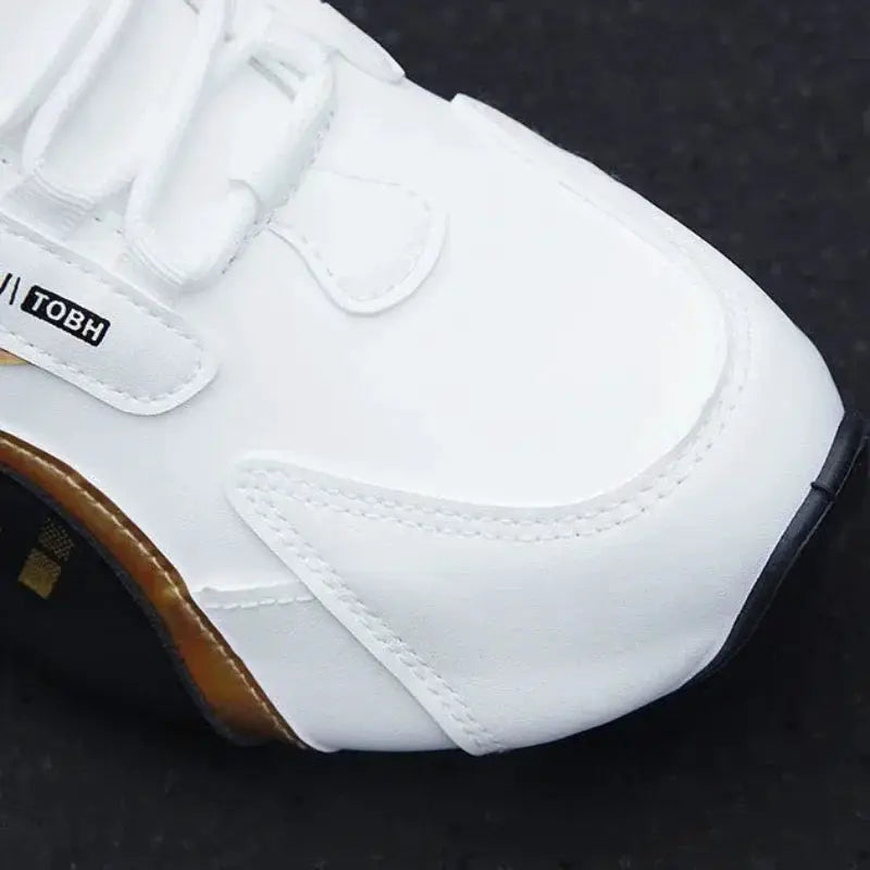 Men's white PU leather waterproof sneaker with brown sole trim and TOBH logo