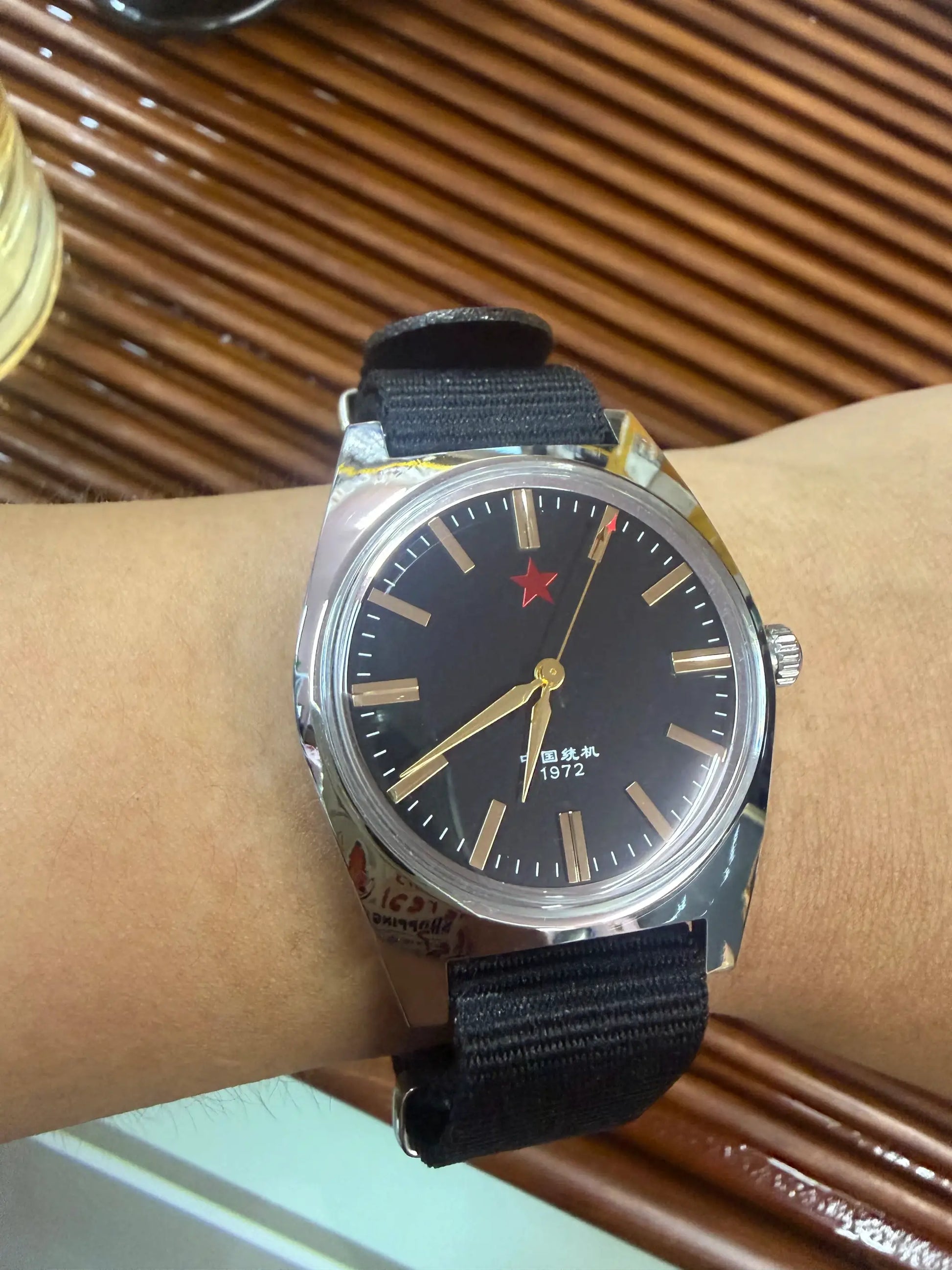 Men's 36mm mechanical watch with stainless steel case, black dial, gold hands, red star, black nylon strap