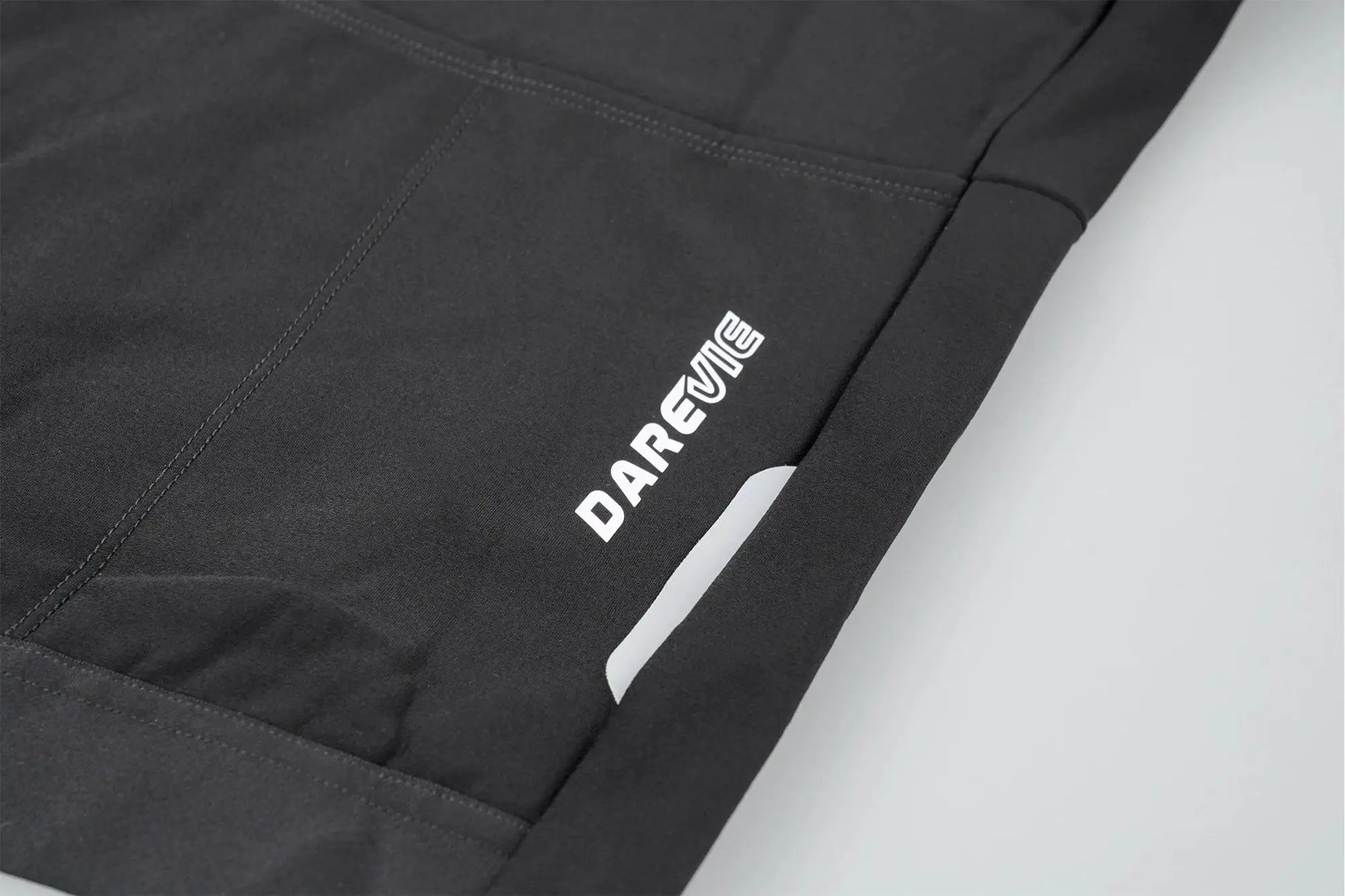 DAREVIE cycling jersey in black fabric with white logo detail on the side

