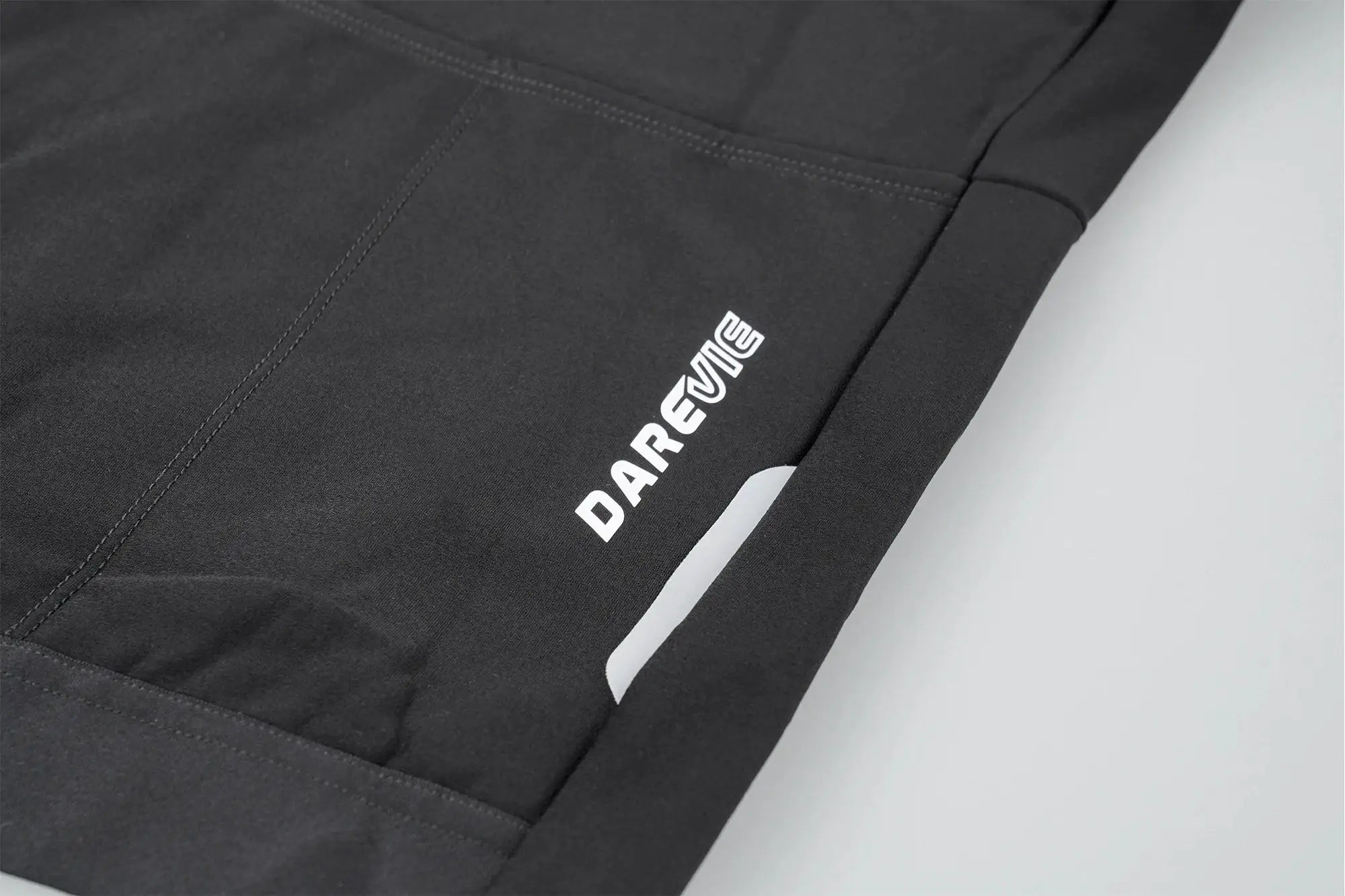 DAREVIE cycling jersey in black fabric with white logo detail on the side

