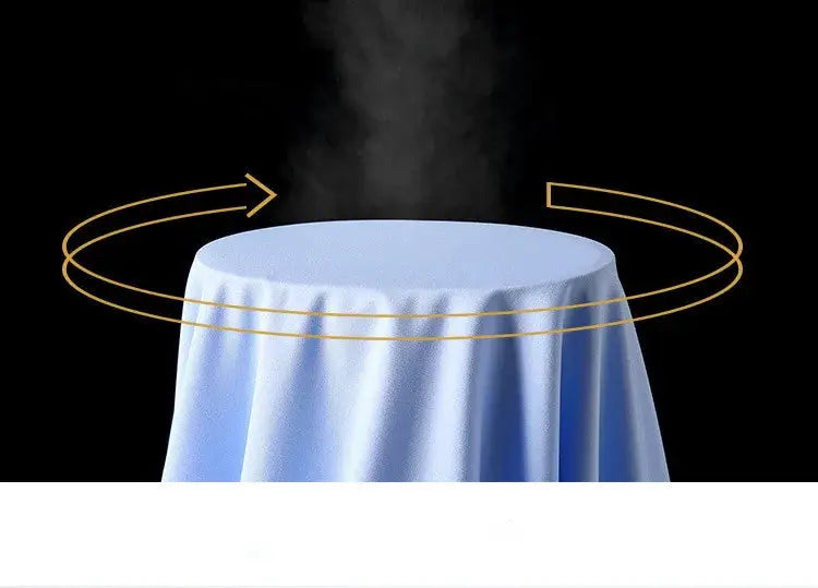 Dress shirt display in light blue fabric with steam and gold circular arrows around a round table.