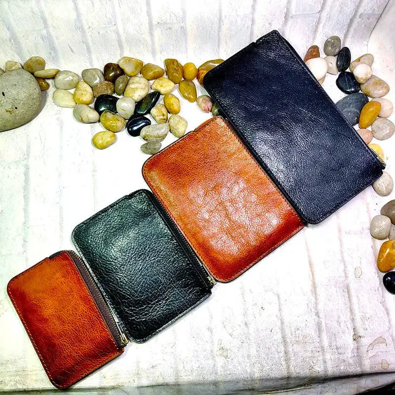 Mini zipper waist bag leather belt pack; four leather pouches in brown, green, tan, and black with zipper closures