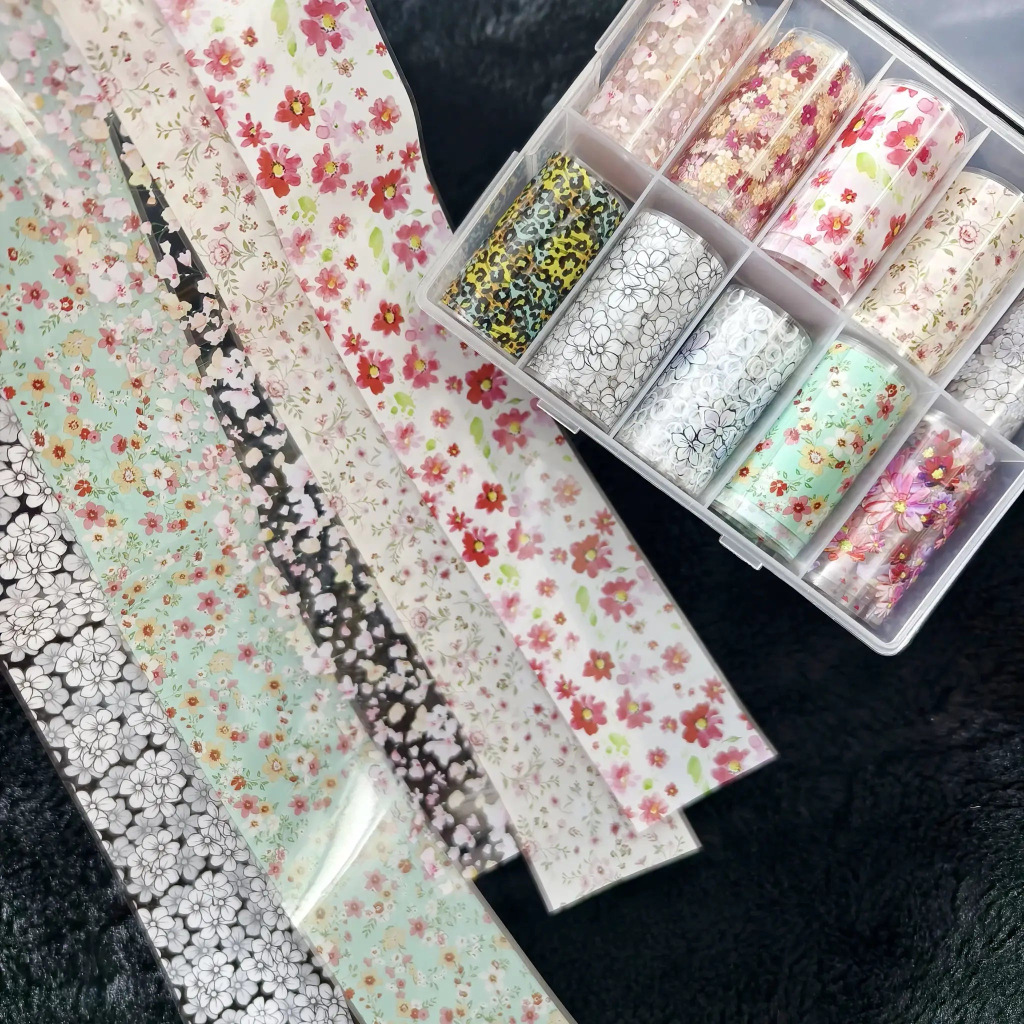 10-roll nail foil set by Simples Market with floral, plaid and marble designs in a clear organizer