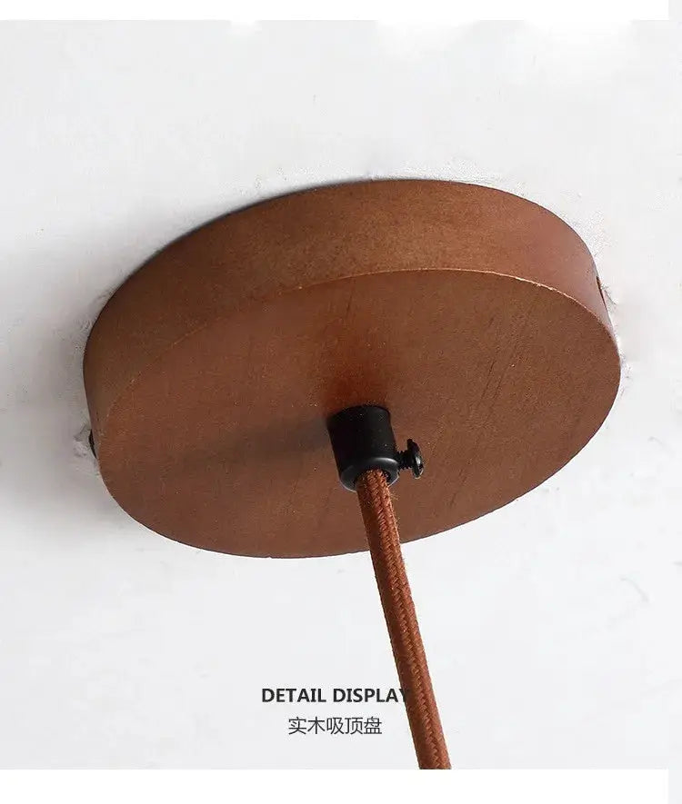 Vintage pendant light canopy in warm brown wood with braided fabric cord