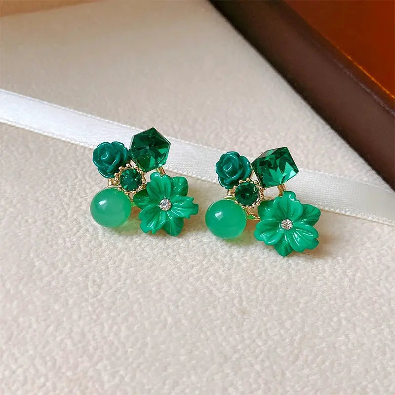 Green flower earrings with geometric green stones and round bead accents, set of 2