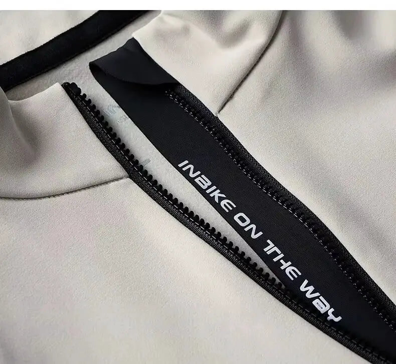 Winter cycling jersey with beige fleece fabric and front zipper; INBIKE branding visible