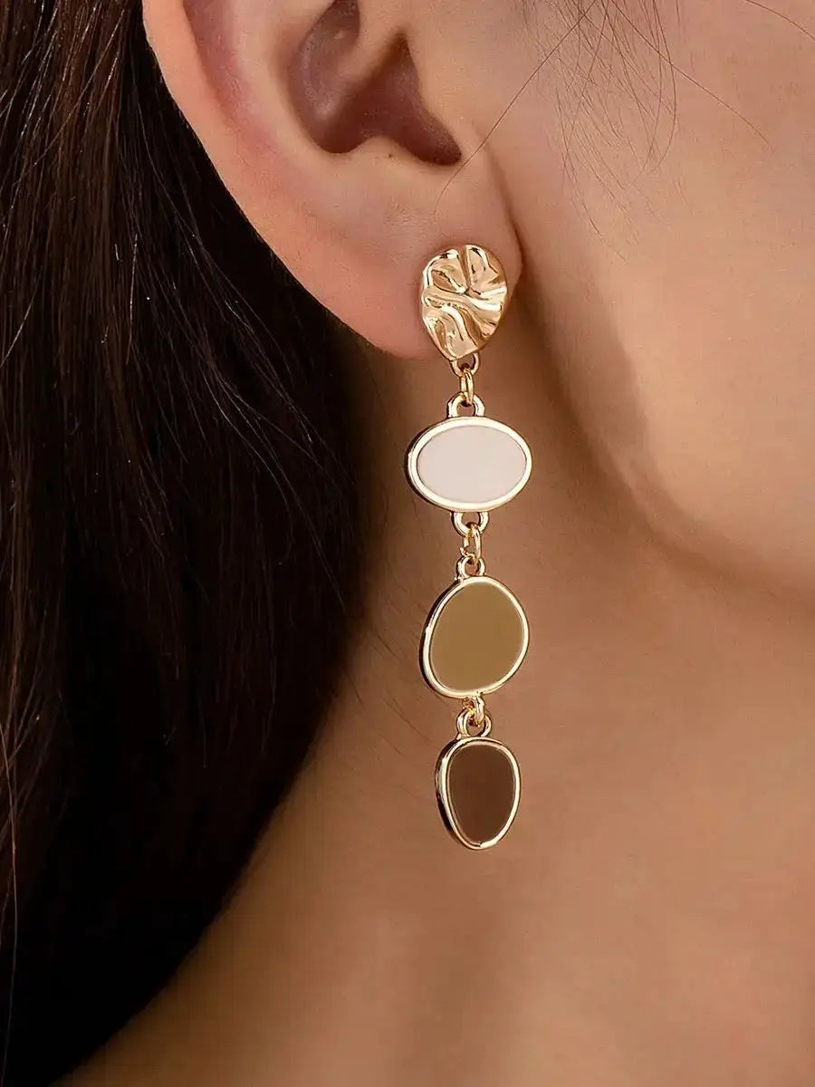 Pair of gold-tone leaf-stud earrings with three oval enamel drops in white, beige, and brown