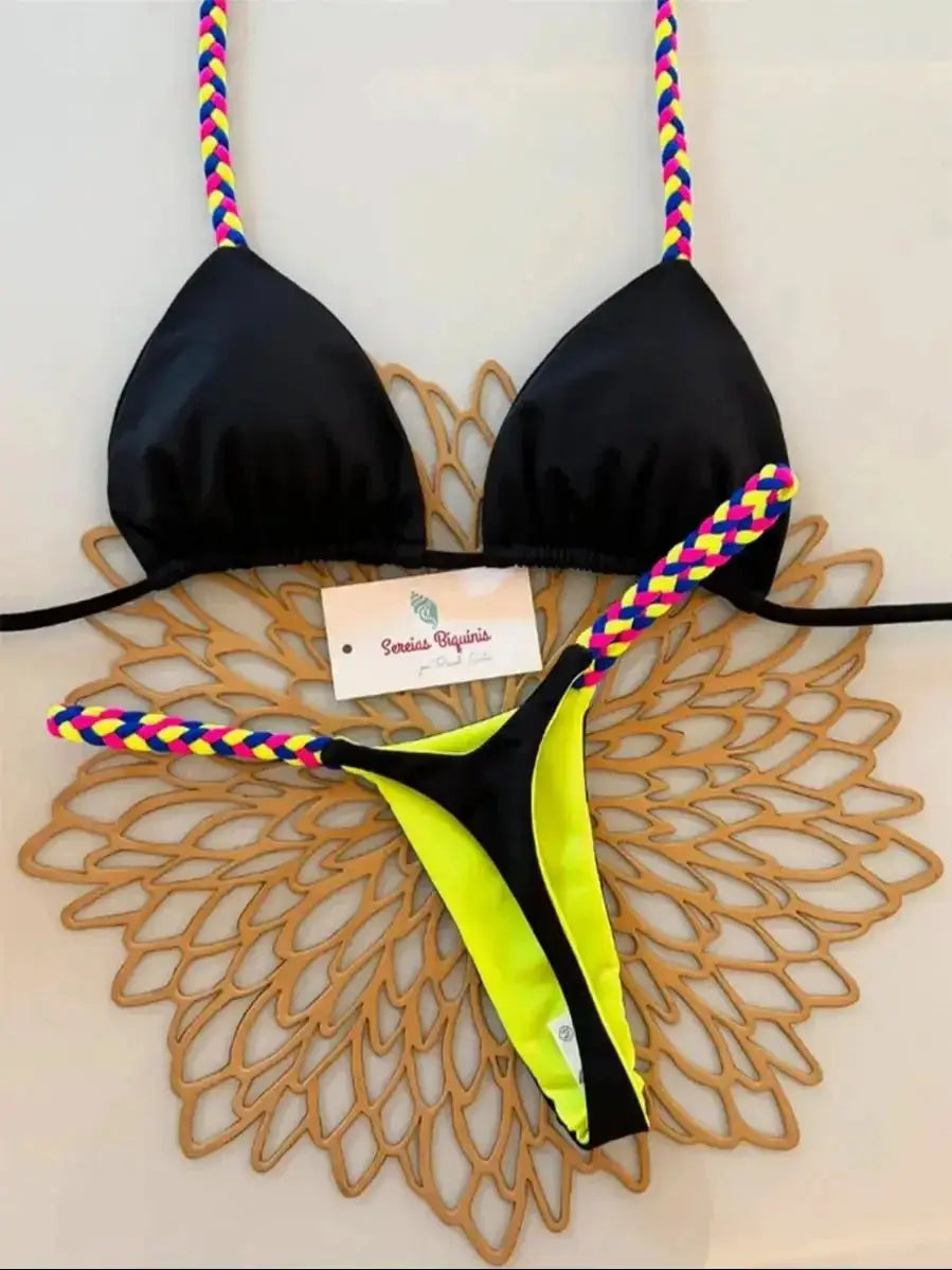Simples Market micro bikini set: black triangle halter top with rainbow braided straps and neon yellow thong bottom.