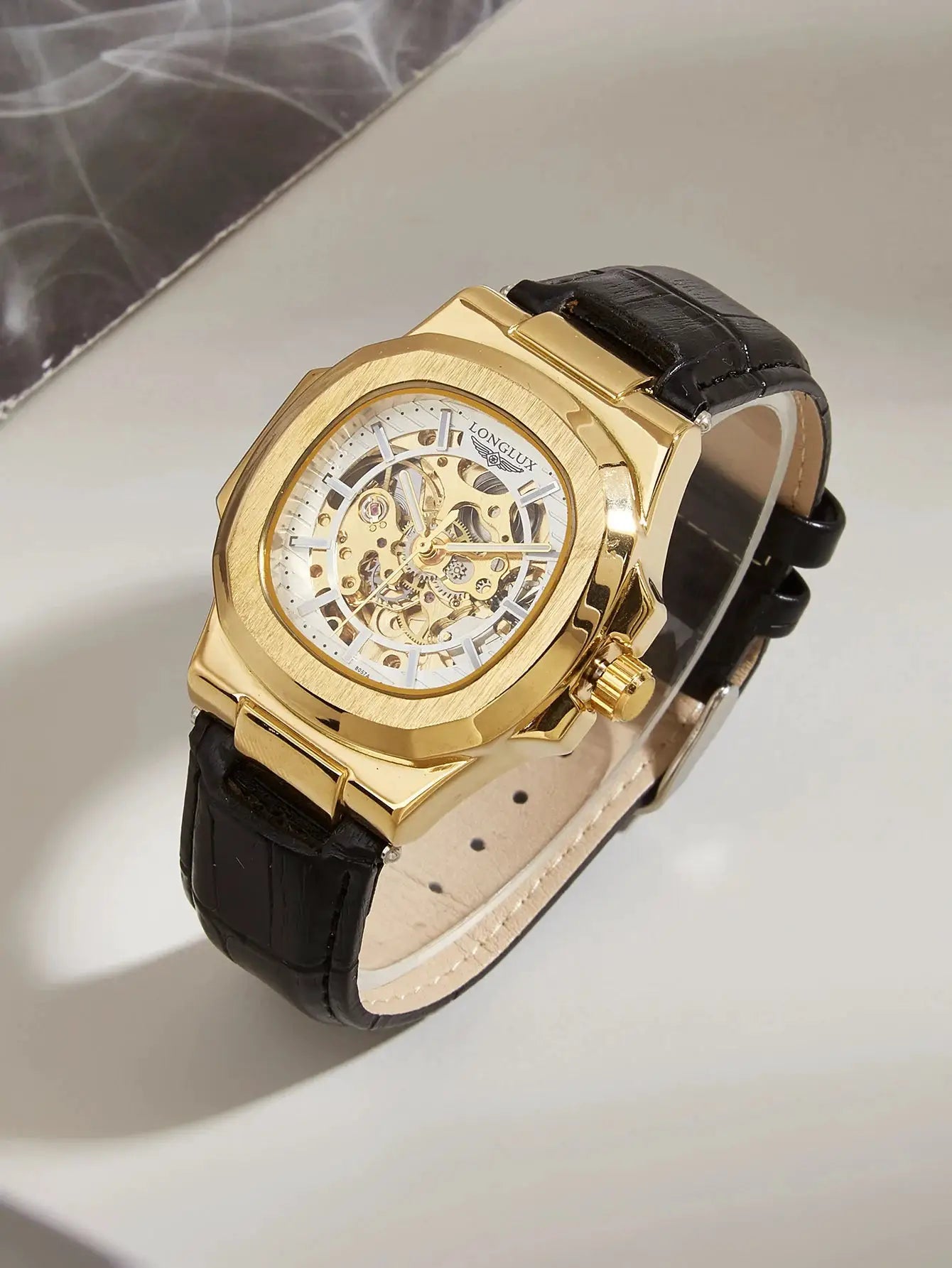 Men's skeleton automatic watch with gold-tone case and black leather strap by Simples Market