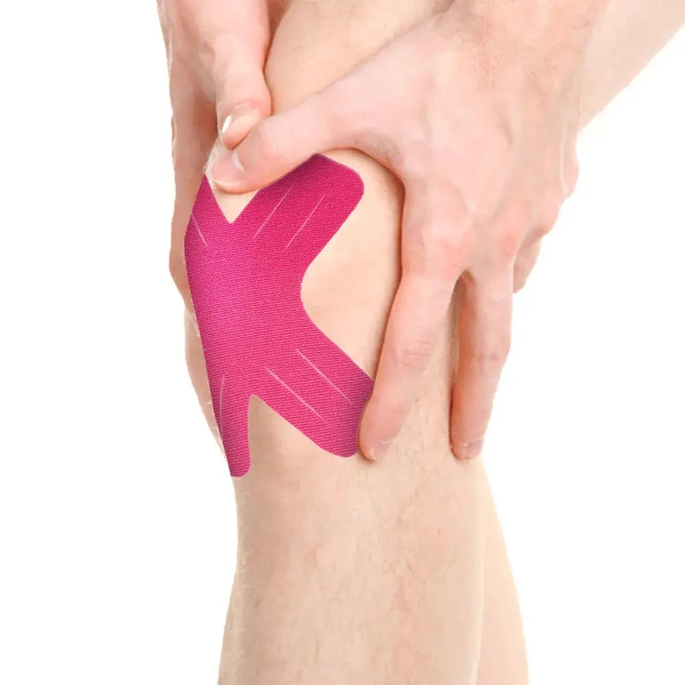 Kinesiology tape pink elastic athletic strips applied to elbow