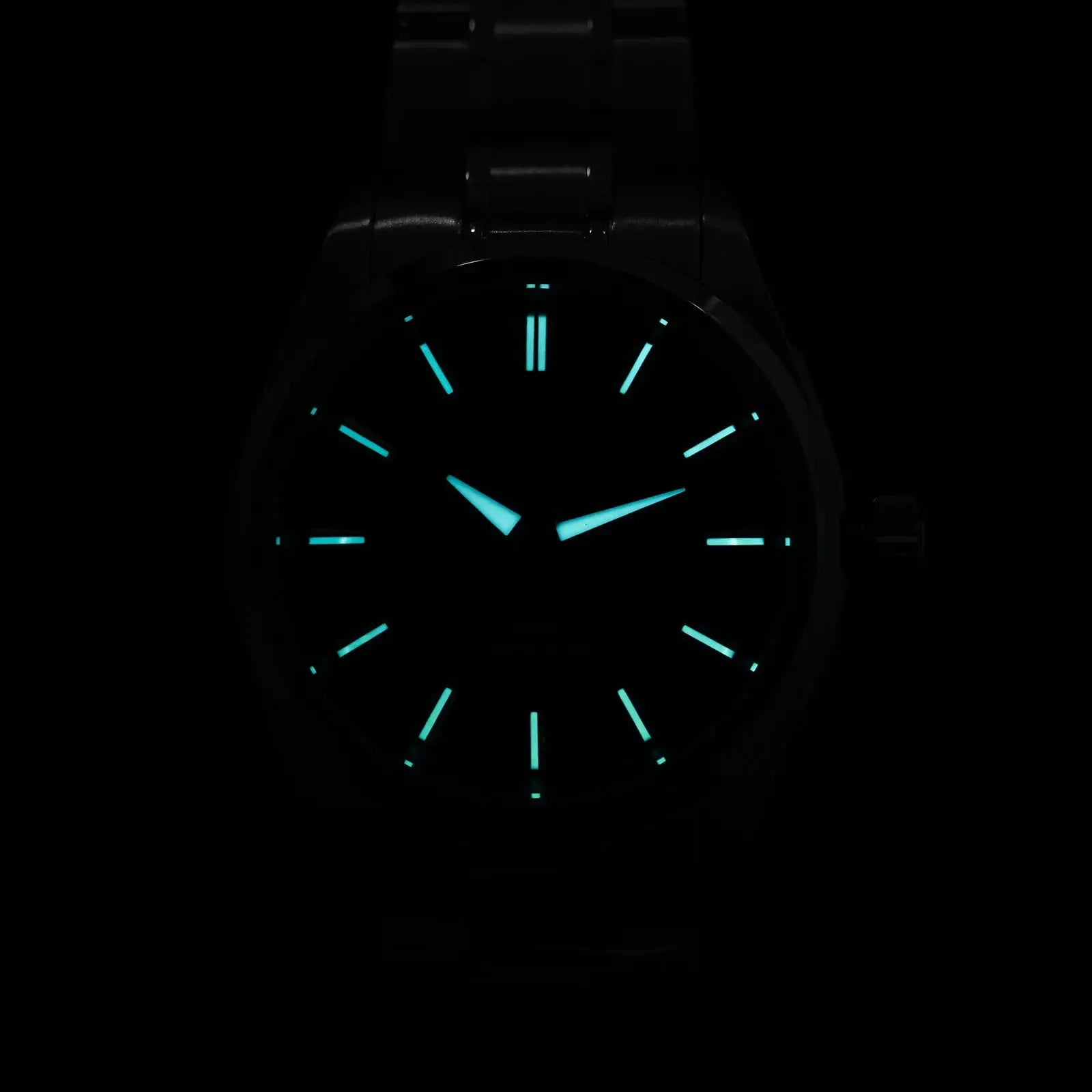 Watchdives WD0003C quartz wristwatch with teal luminous hands on a black dial and metal bracelet