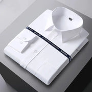 Men's formal shirt, white, long sleeve with button cuffs, neatly folded under a packaging strap.