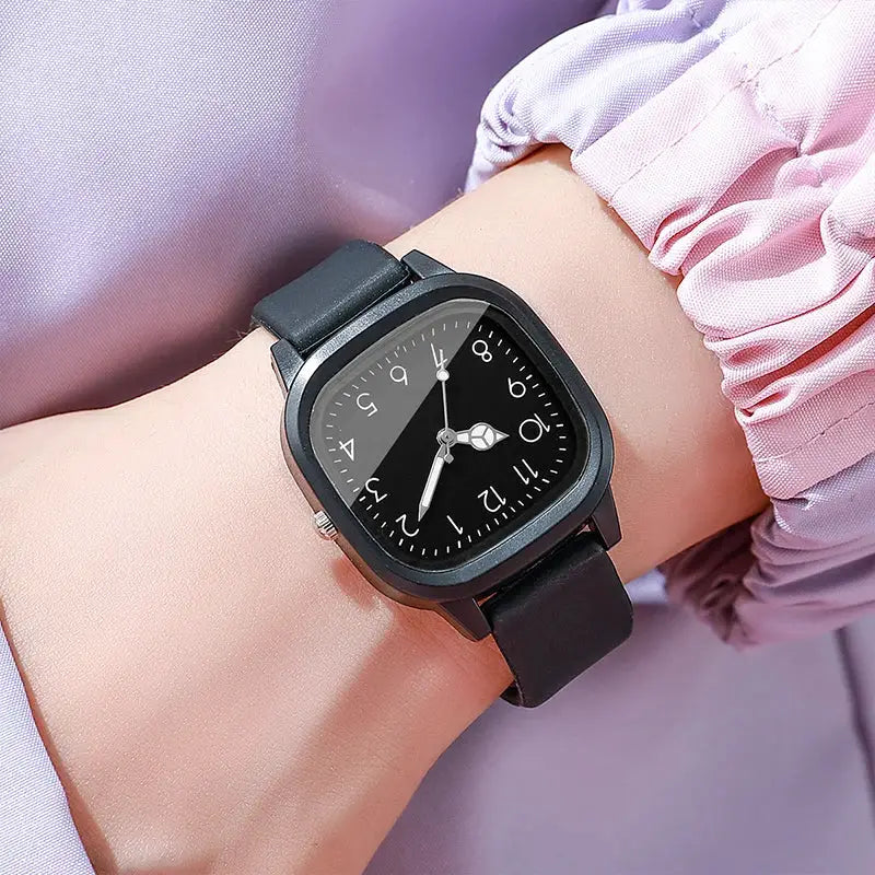 Black silicone-band women's quartz wristwatch with a square dial
