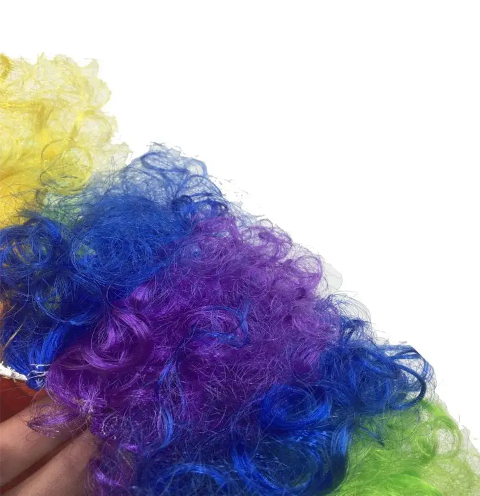 Clown wig with bright multi-color yellow, green, blue and purple curly synthetic fibers