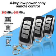 Garage gate remote controls, set of four black and silver keychain fobs, 280–868 MHz multi-frequency.