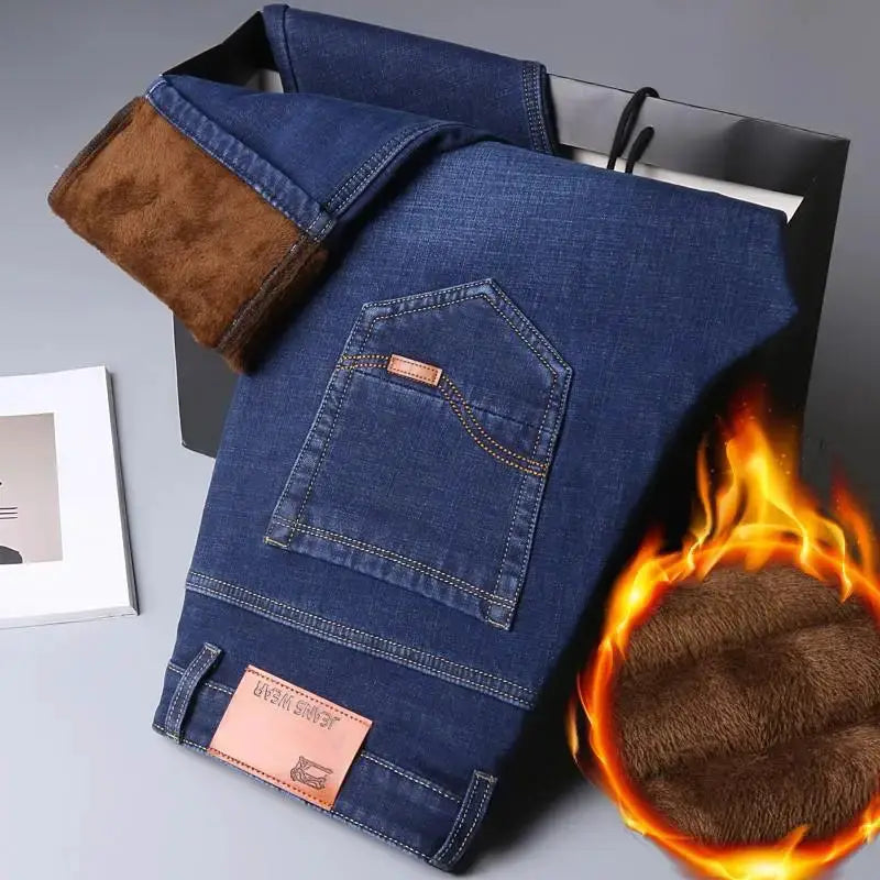 Men's blue denim jeans with brown fleece lining, back pocket detail and pink leather brand patch by Simples Market