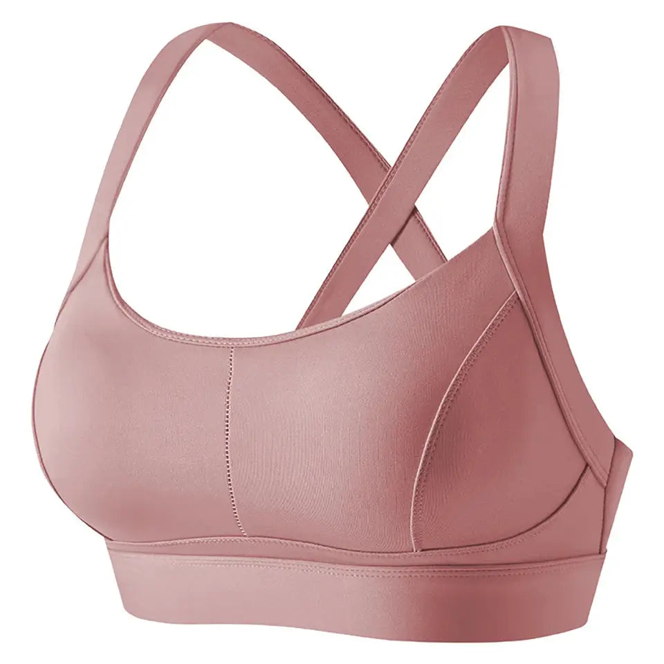 Women's high-impact sports bra by Simples Market, pink with criss-cross back and padded cups.