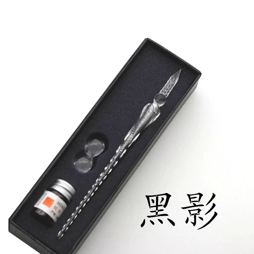 Crystal glass dip pen gift set in a black presentation box with ink bottle and nib accessories