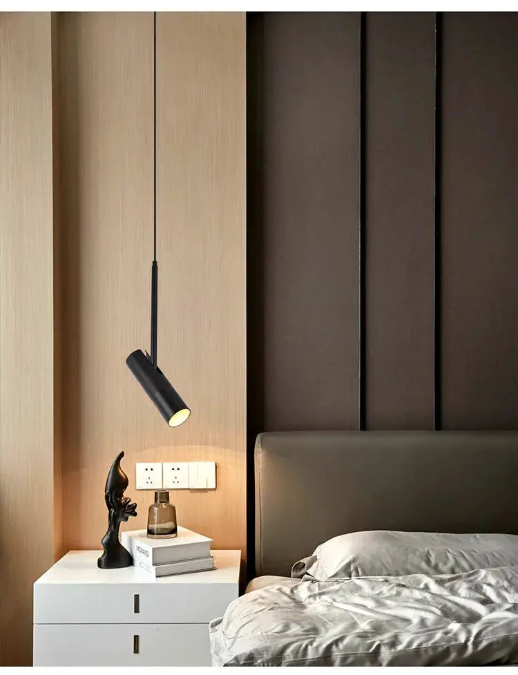 Minimalist LED hanging pendant light, black metal cylindrical fixture, ideal for bedrooms or dining spaces.
