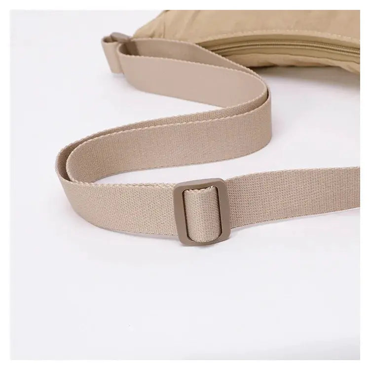 Simples Market nylon crossbody bag with beige adjustable strap, zipper, crescent-shaped dumpling design, large capacity