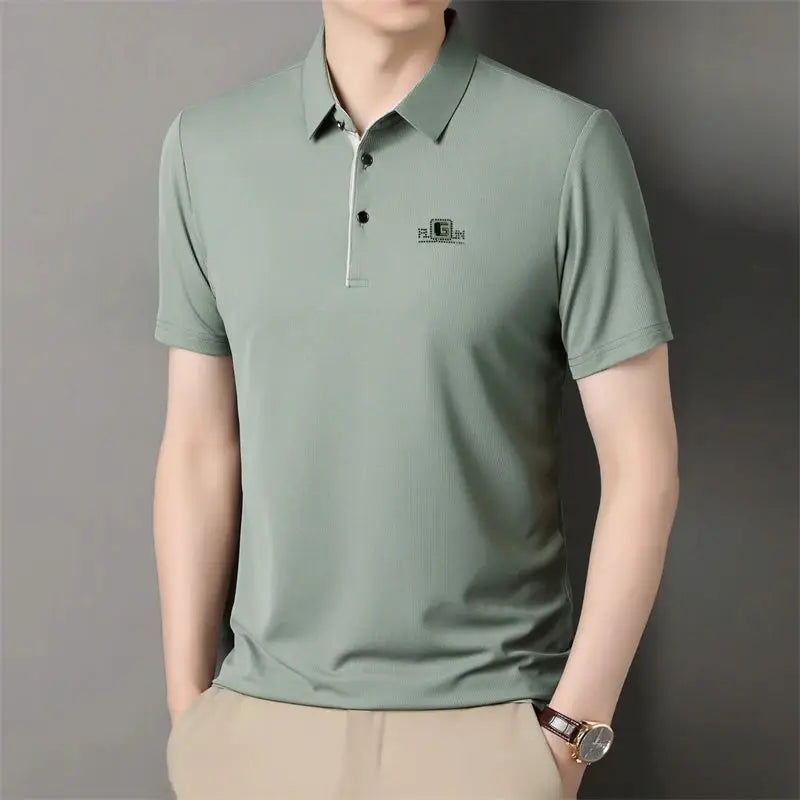 Men's polo shirt by Simples Market in mint green with badge logo and short sleeves.