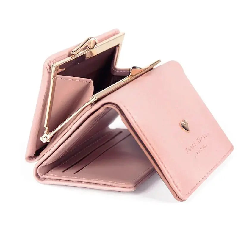 Pink mini folding wallet with a gold-tone metal frame and card slots