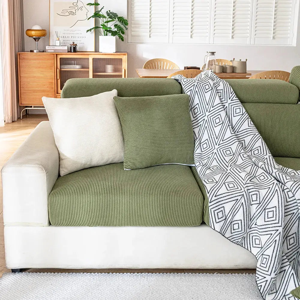 Jacquard sofa seat cushion covers in olive green on a beige sectional