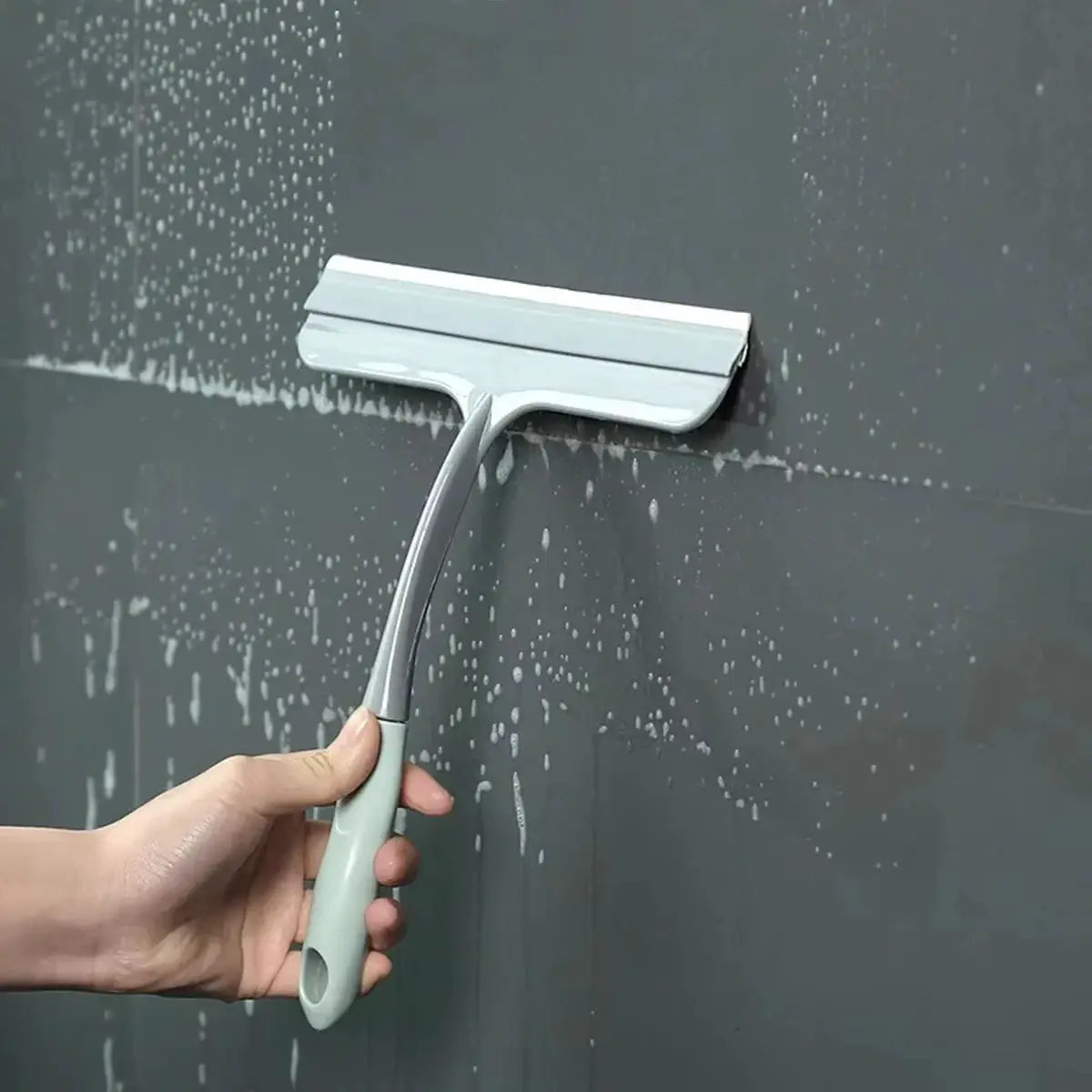 Silicone scraper wiper by Simples Market; gray handle with wide silicone blade for glass, windows, shower doors.