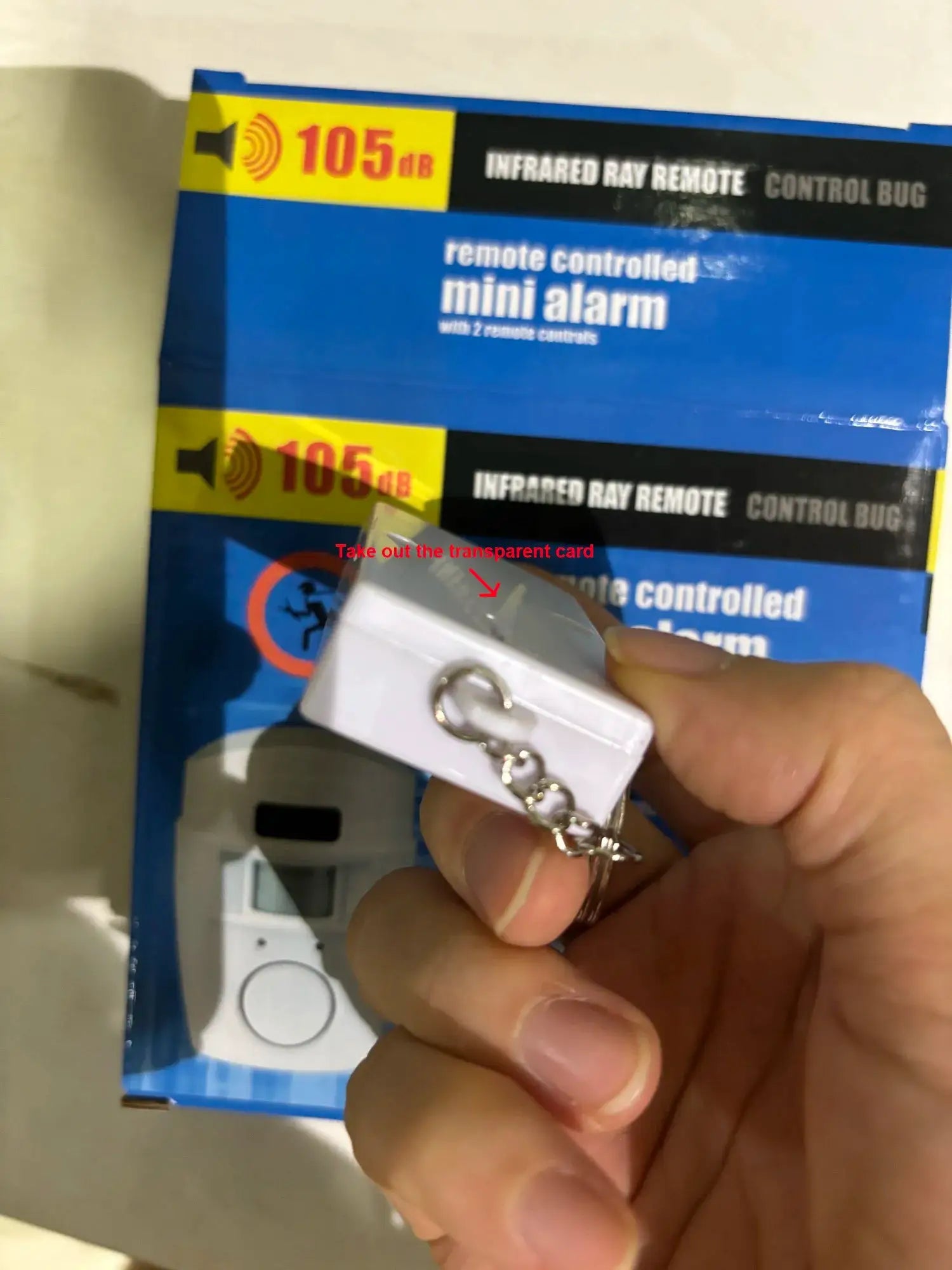 Simples Market wireless motion sensor alarm, white handheld device shown against blue packaging