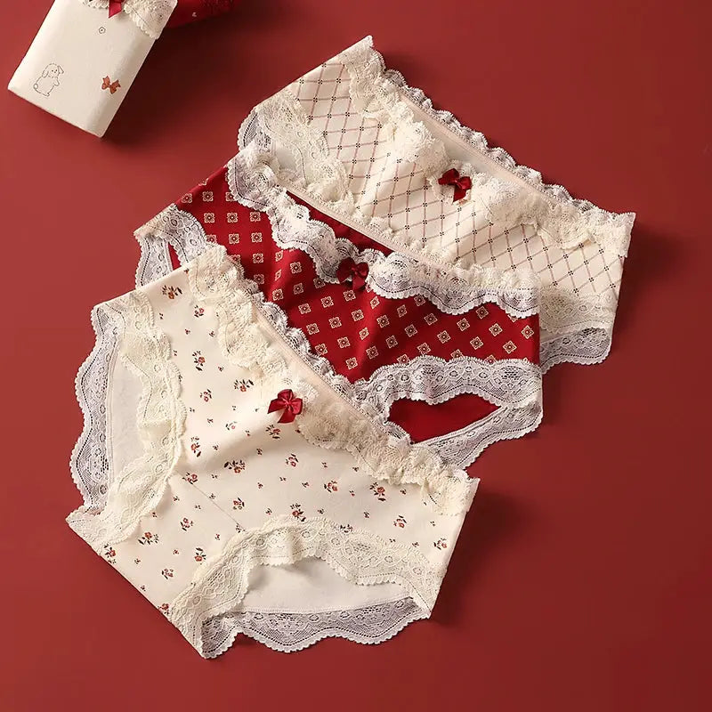 Triangular panties set, 3-pack in ivory, burgundy and cream with lace trim and floral prints