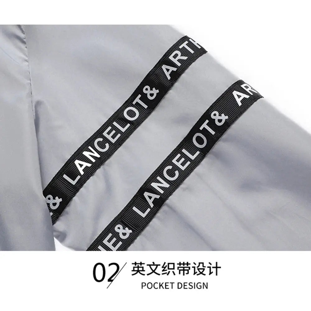 Men's sun-protection cycling jacket in light gray with diagonal black tape stripes reading LANCELOT & ART