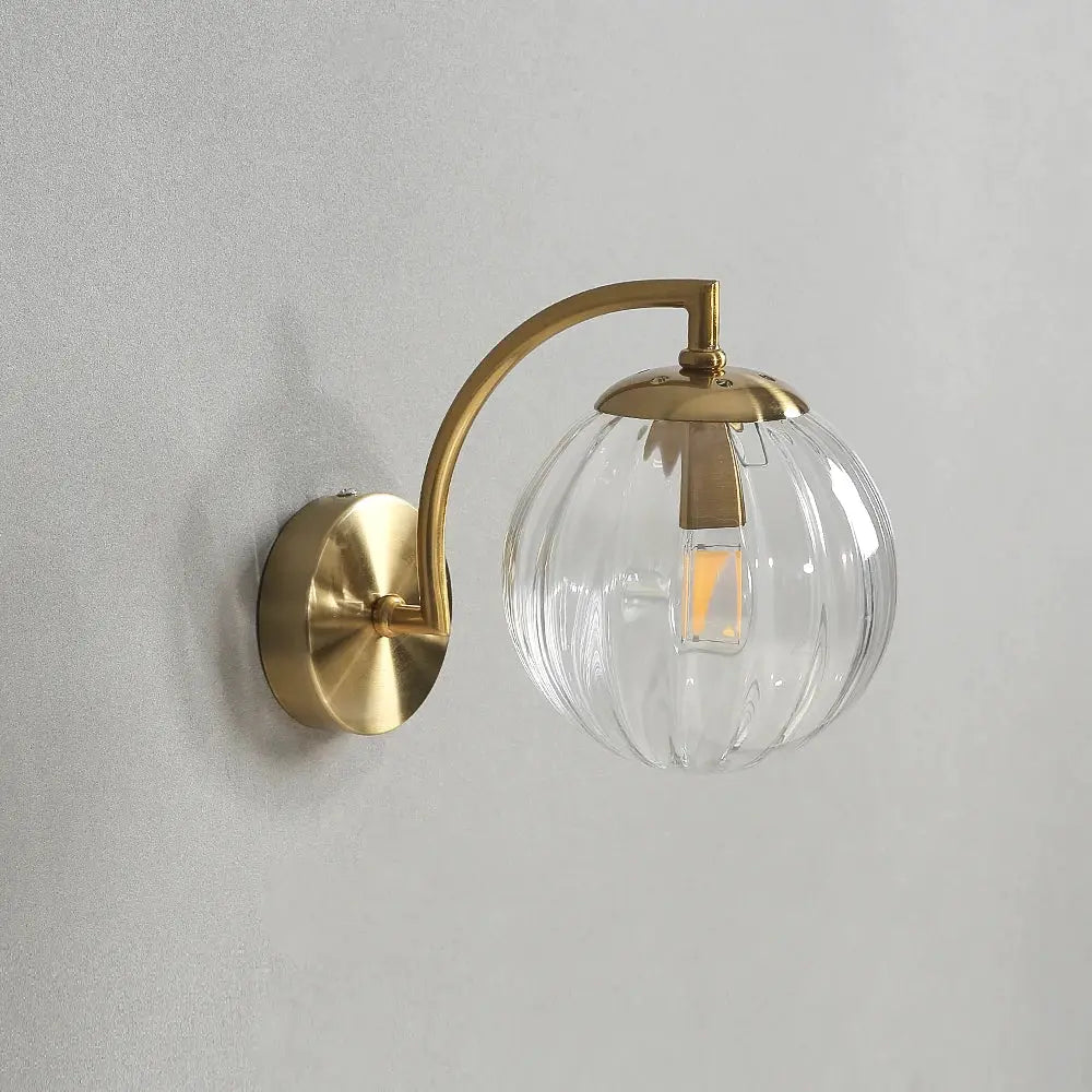 Simples Market brass glass globe wall lamp with curved arm and clear ribbed shade