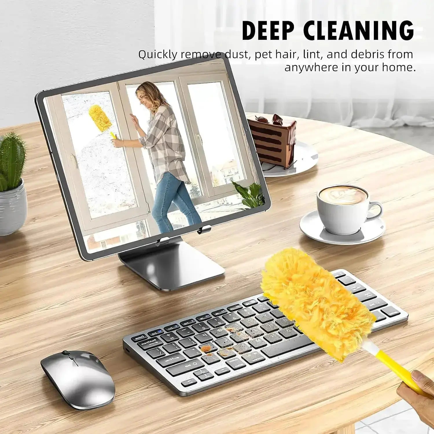 Disposable feather duster with yellow fluffy head on desk beside keyboard and monitor