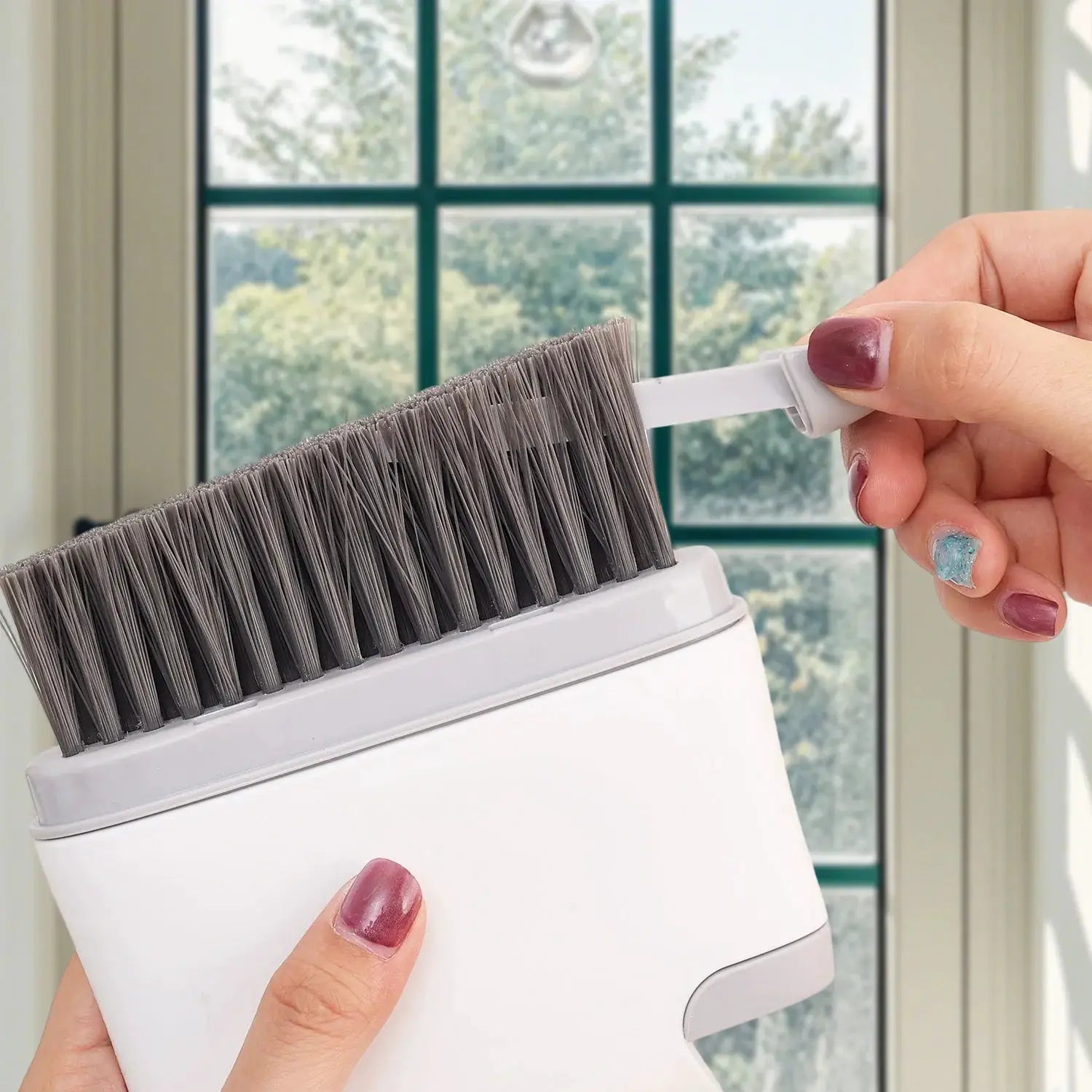2-in-1 window cleaning brush with detachable handle; white body and gray bristles