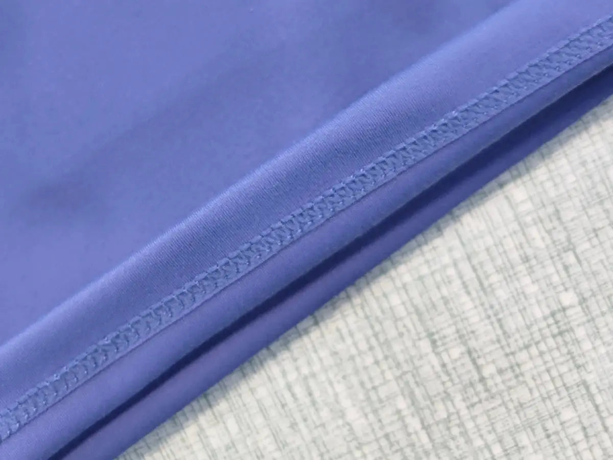 Women’s purple sport shorts with visible stitched hem and quick-dry fabric.