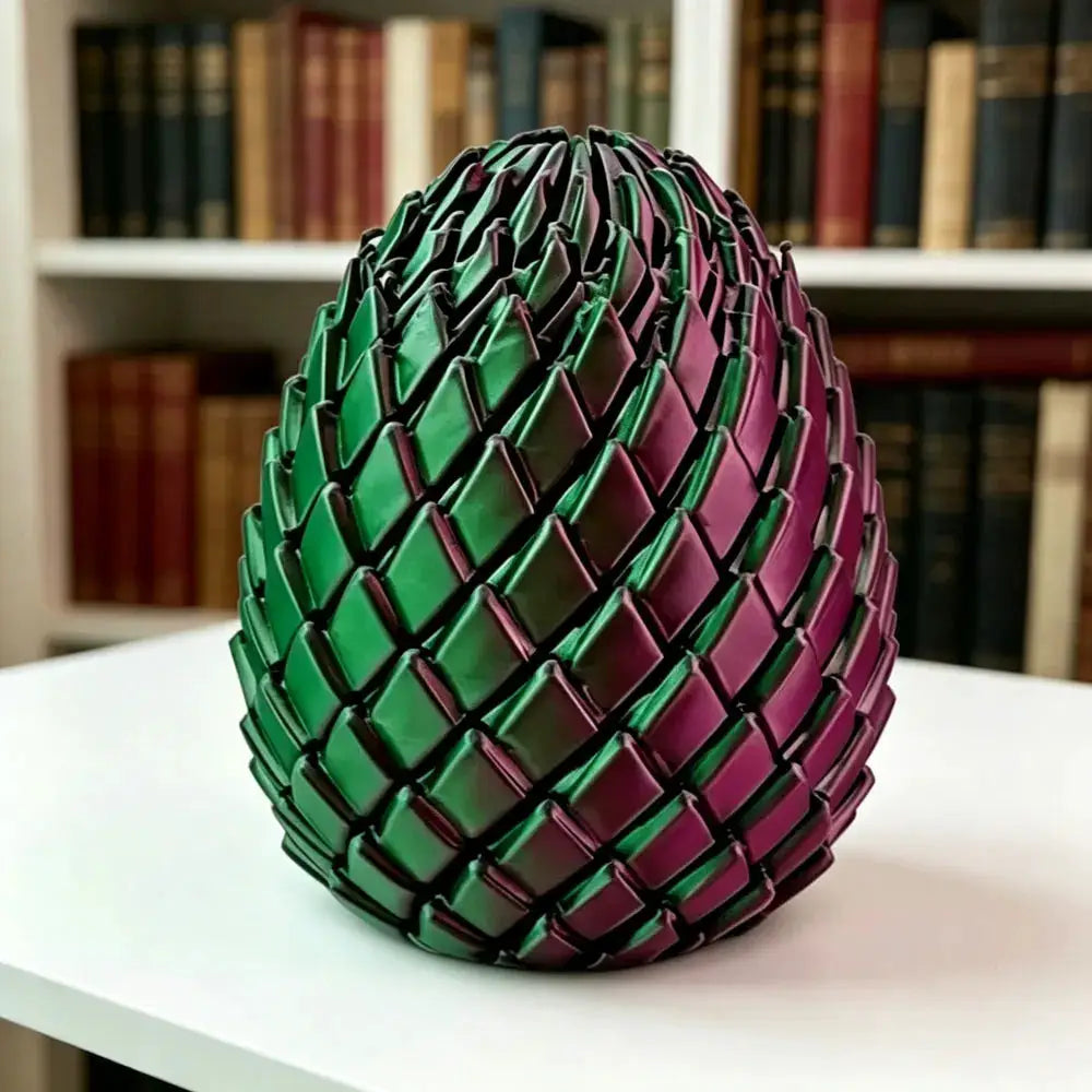 3D-printed Dragon Egg Stress-Relief Model by Simples Market, deformable twist egg in green and purple scales