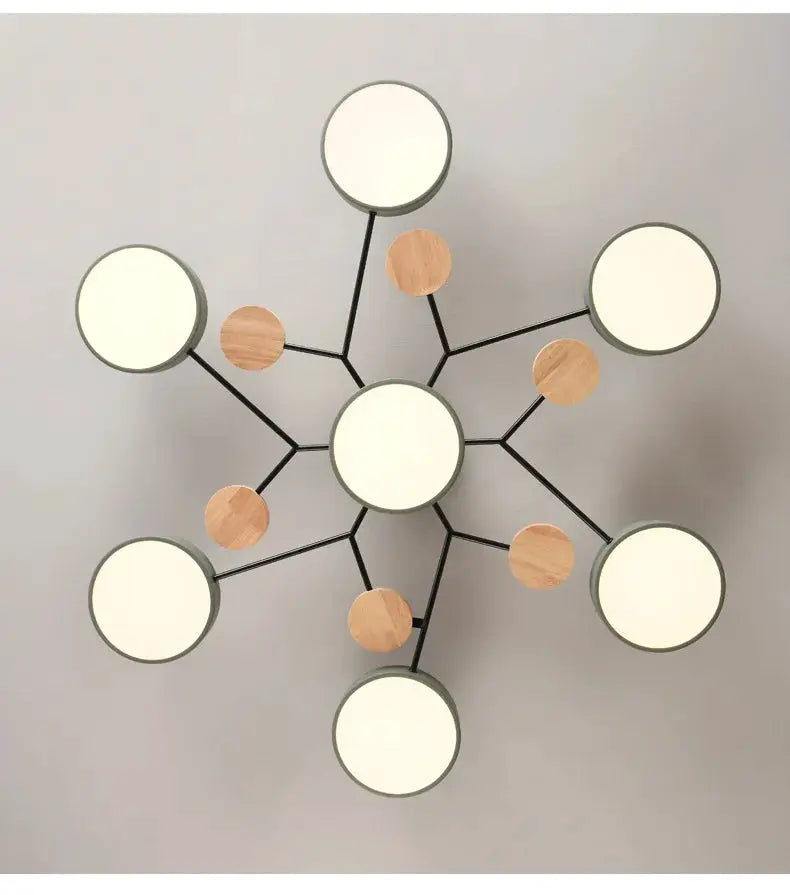 Modern LED chandelier ceiling pendant lamp with black metal starburst arms, white circular lights and wood accents.