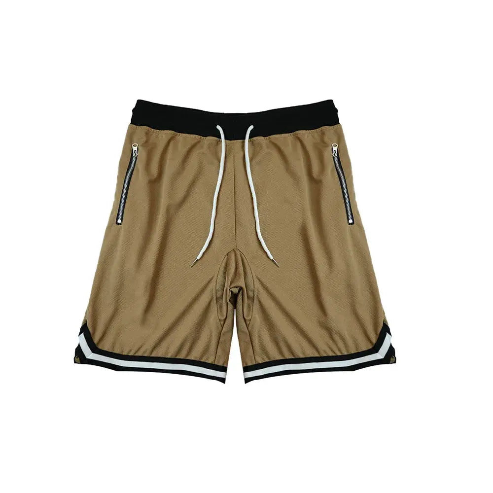 Men's basketball shorts in tan with black waistband, white drawstrings, side zip pockets, and striped hem