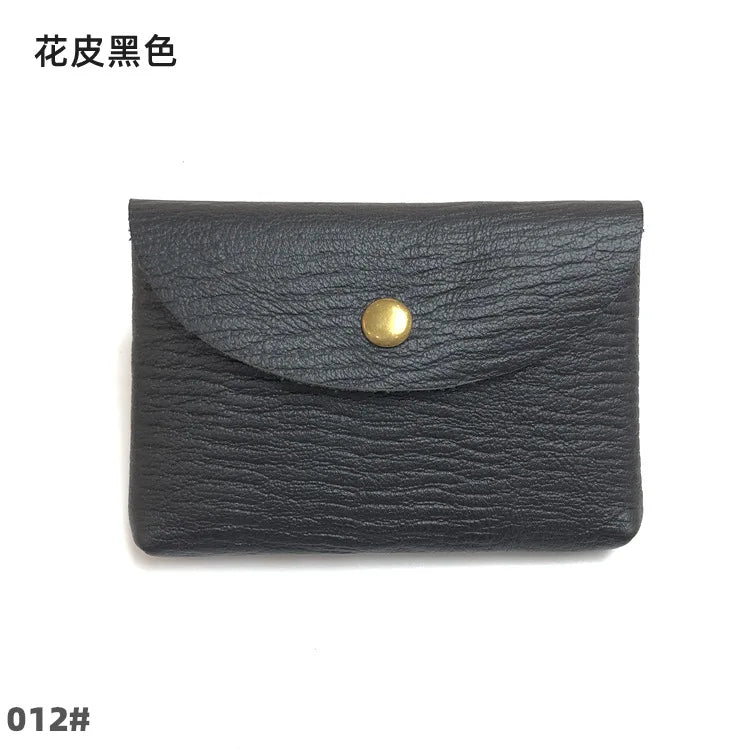 Card holder in black genuine leather with a flap and gold snap closure